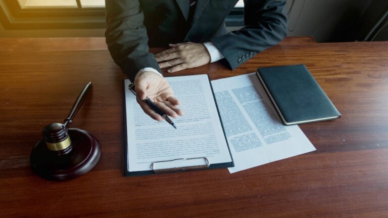 lawyer at desk with paperwork